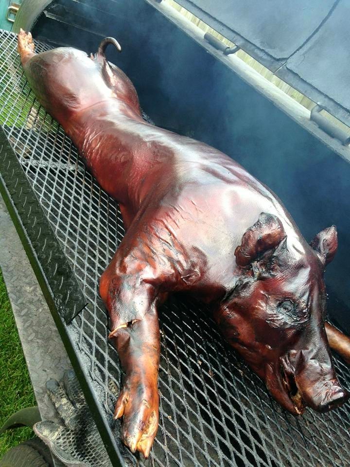 Whole hog roasting in a HogZilla BBQ smoker